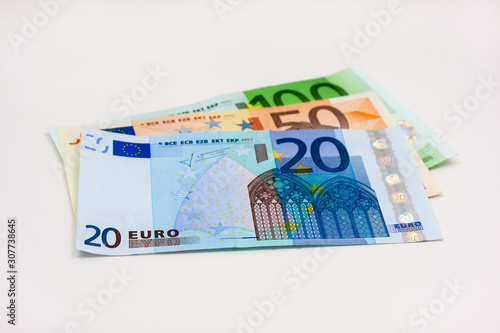 Three different euro banknotes on white background