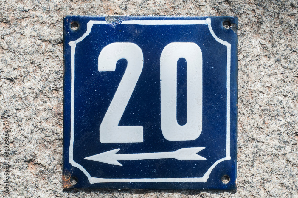 Weathered grunge square metal enameled plate of number of street address with number 20 closeup Weathered grunge square metal enameled plate of number of street address with number 20 closeup
