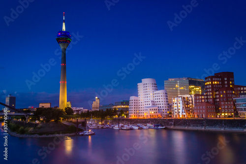 Dusseldorf  Germany - Blue Hour Evening View around the World in Dusseldorf at the Rhine River  the TV Tower and the Iconic Harbor Buildings at Night