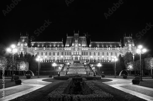 Palace of Culture in Iasi, Romania. Evening illumination of the palace, cityscape. The building combines several architectural styles: neo-Gothic, romantic and neo-baroque.