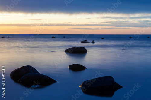Long Exposure, Boulders In An Calm Baltic Sea Outside Norderstrand On The Ilsnad Of Gotland, Sweden