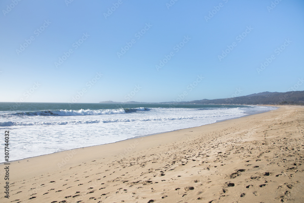Wide angle view of a sandy beach coastline