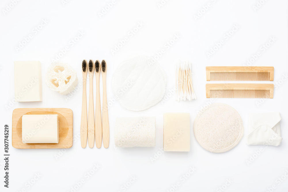 Zero waste with natural biodegradable self care products on blue. Bamboo  toothbrushes, handmade soap shampoo bars, cotton buds pads, hygiene products  luffa on white, top view, selective focus Stock-Foto | Adobe Stock