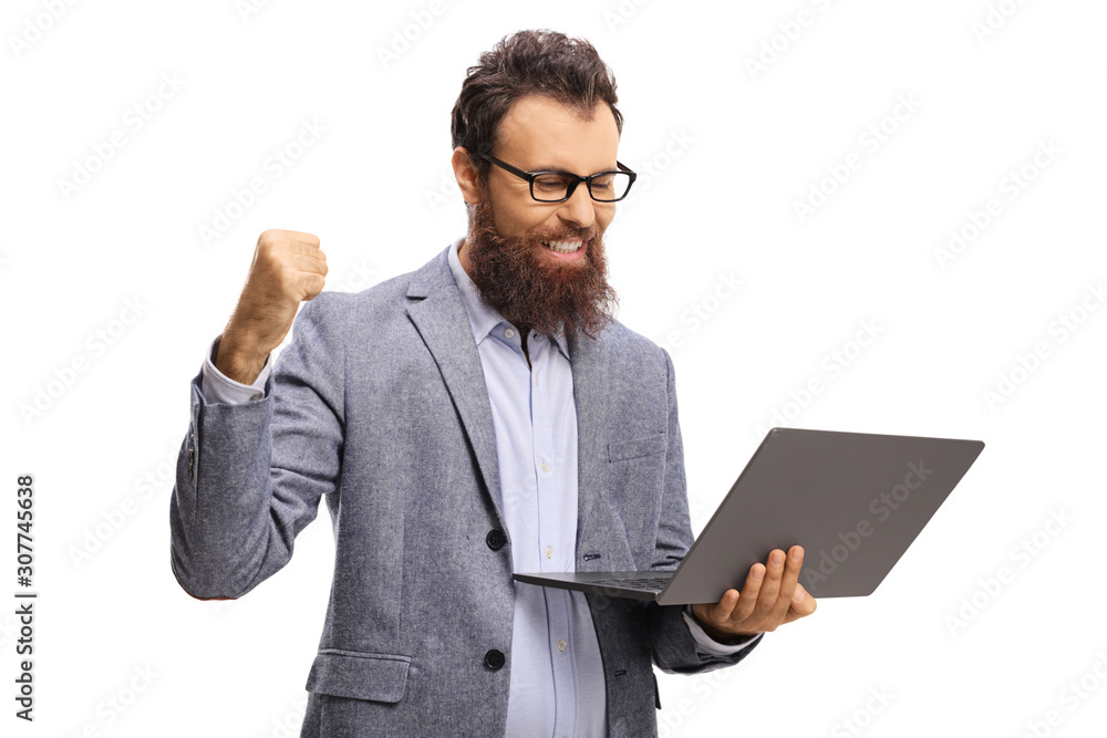 Bearded man with gesturing success and looking at a laptop computer Bearded man with gesturing success and looking at a laptop computer