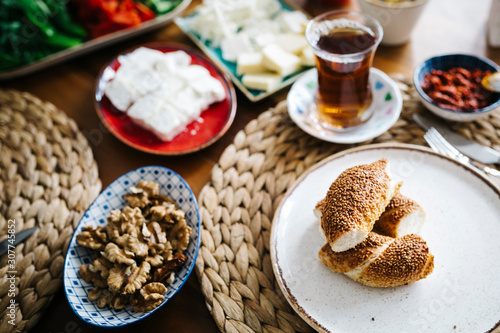 Turkish traditional Breakfast with bagel (Turkish Simit), blur background and in front of the photo there is Turkish Bagel