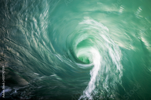 Tableau sur toile Water vortex with saturated natural colour.