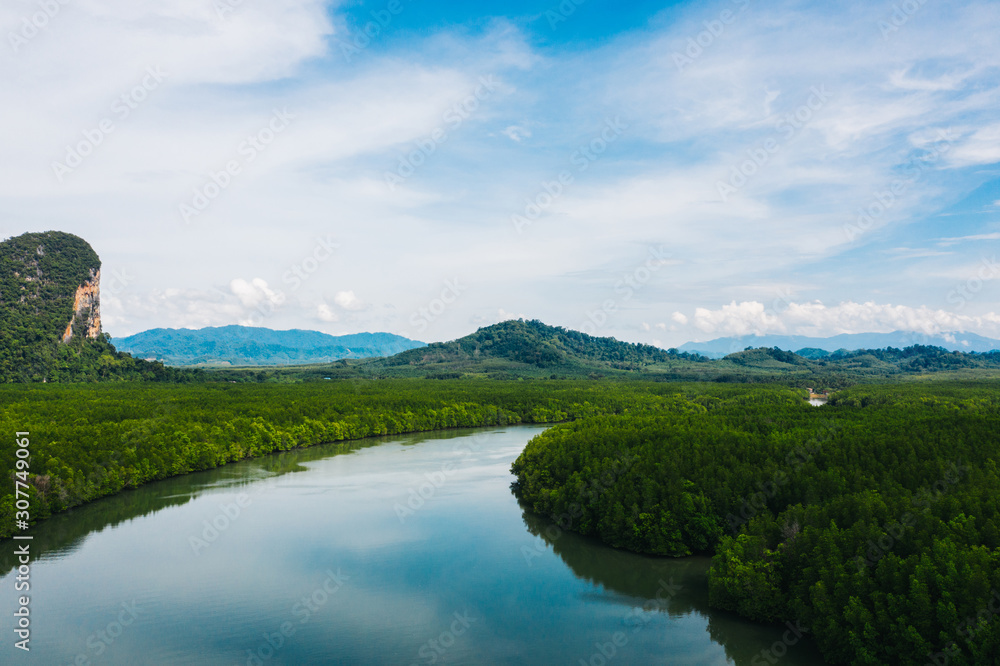 Aerial scenery view of mangroves forest, river canals and mountains. Bird's eye view of beautiful panoramic nature landscape of tropical water jungle on Ao Phang Nga bay National Park, Thailand