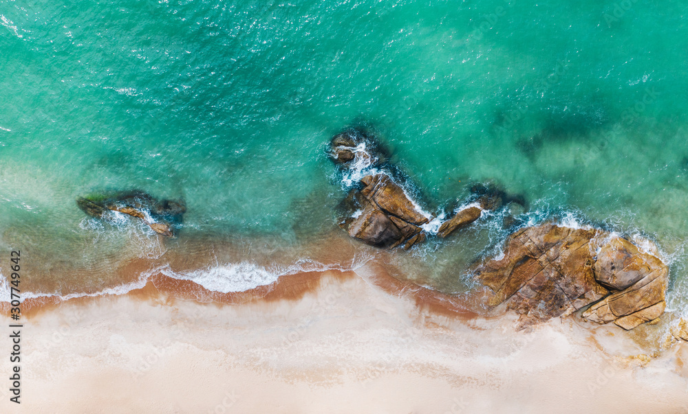 Aerial scenery of picturesque coastline with turquoise crystal water and foam waves. Bird's eye view of paradise beach shoreline of Hawaii, beautiful tourist destination for summer vacations holidays Aerial scenery of picturesque coastline with turquoise crystal water and foam waves. Bird's eye view of paradise beach shoreline of Hawaii, beautiful tourist destination for summer vacations holidays