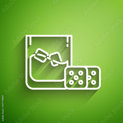 White line Game dice and glass of whiskey with ice cubes icon isolated on green background. Casino gambling. Vector Illustration