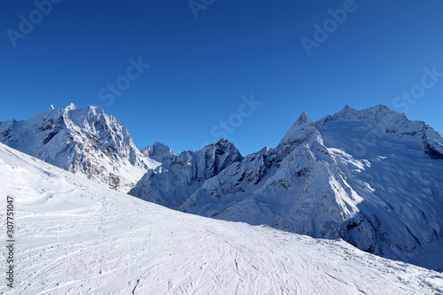 Snowy Mountains peaks and the blue sky Caucasus © Mokrousov Boris