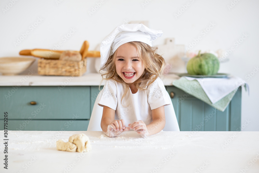 cute laughing girl with dough for cookies on kitchen cute laughing girl with dough for cookies on kitchen