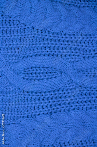classic blue knitted sweater closeup background