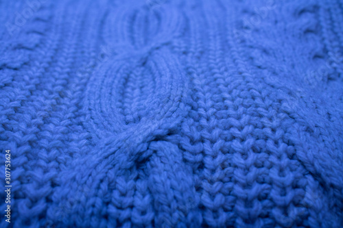 classic blue knitted sweater closeup background