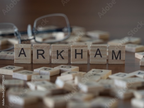 arkham the word or concept represented by wooden letter tiles photo