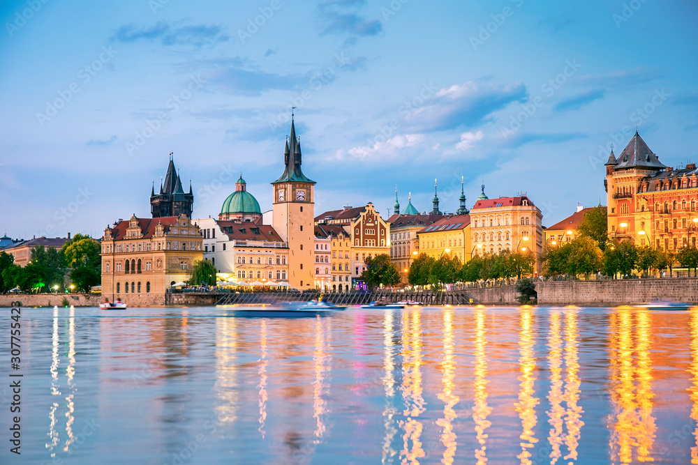 Fototapeta premium Illuminated old town and the Vltava in Prague at night, Czech republic