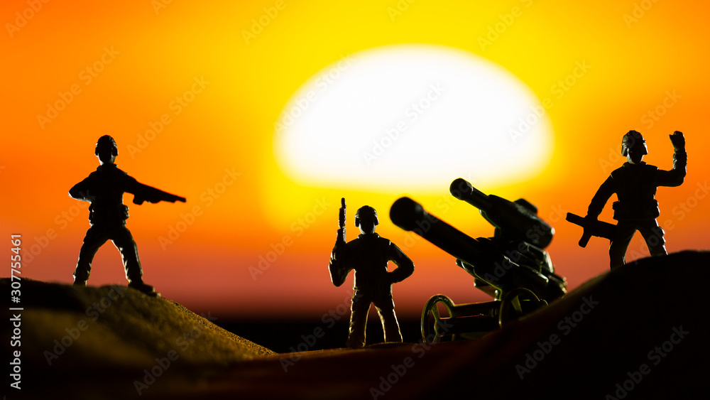 Toy Army Men at Sunrise in Desert Landscape