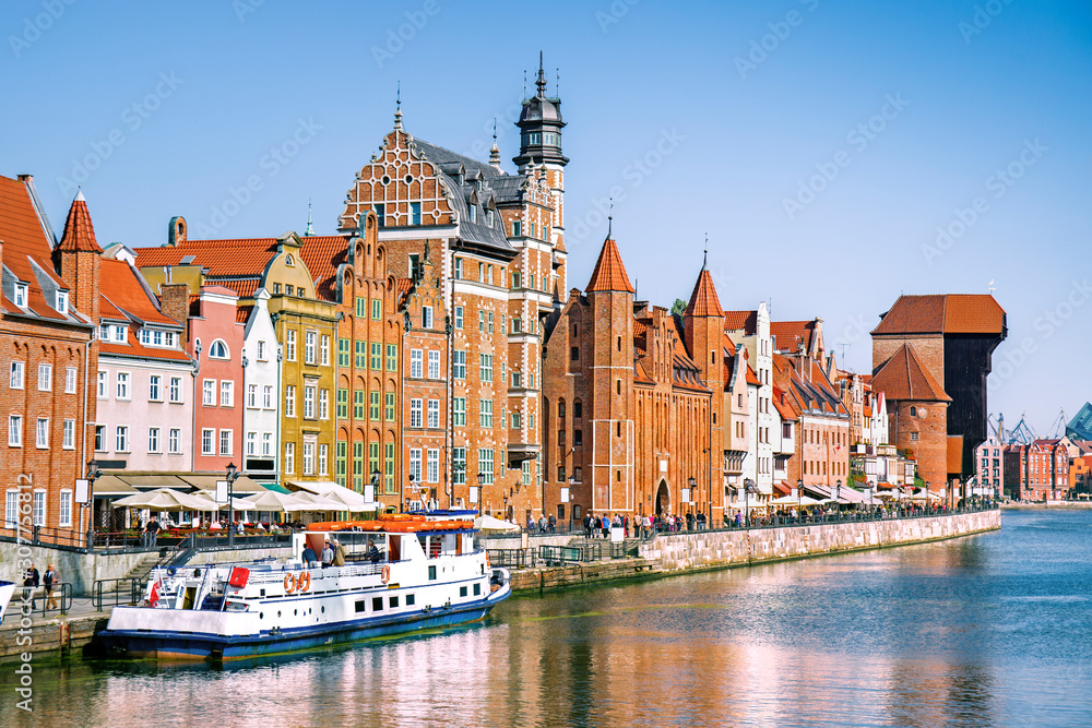 Scenic embankment of the Motlawa river with historical buildings in Gdansk, Poland