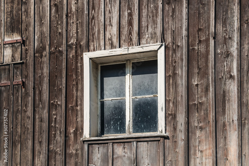 Window in an old wooden house in the Principality of Liechtenstein
