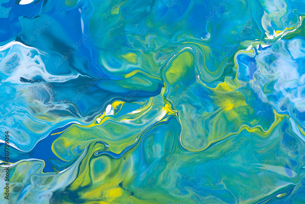Blue and yellow acrylic liquid paint abstract surface