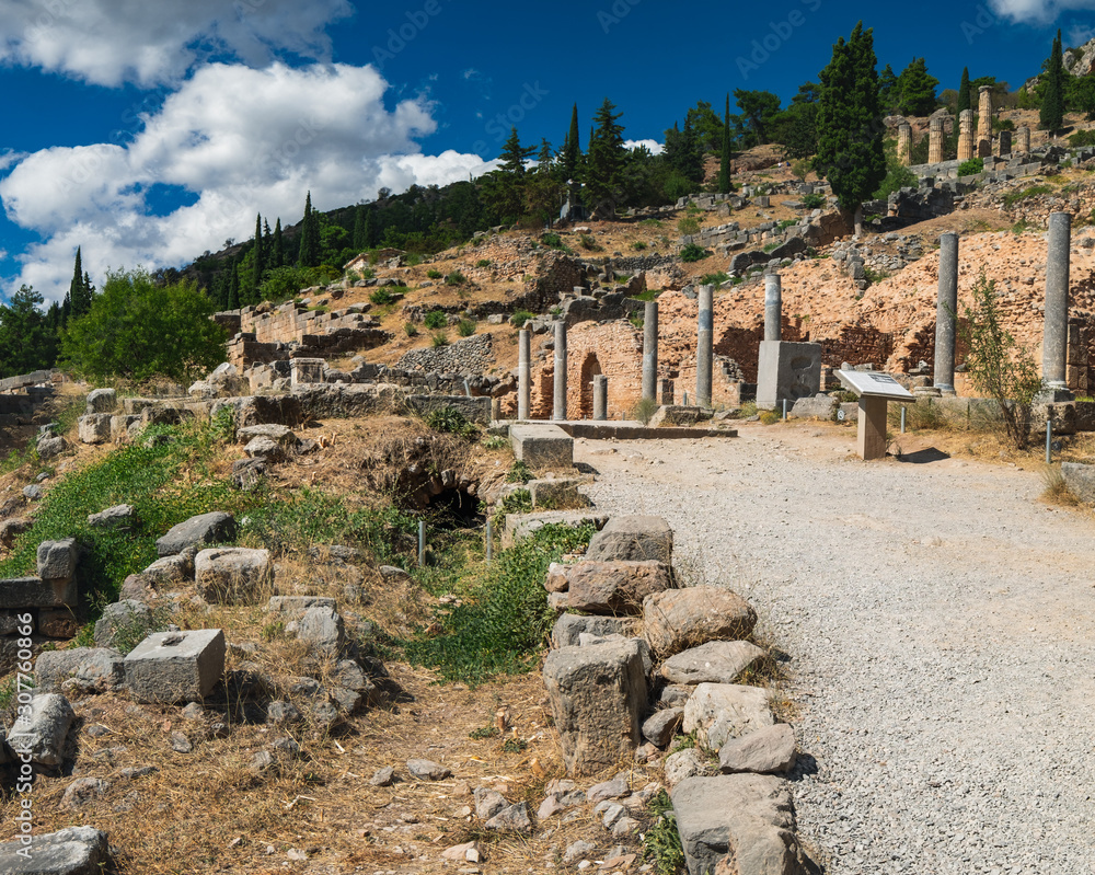 Scenic landscape with road to ancient ruins of the Archaeological Site in Delphi, Greece. Entrance view