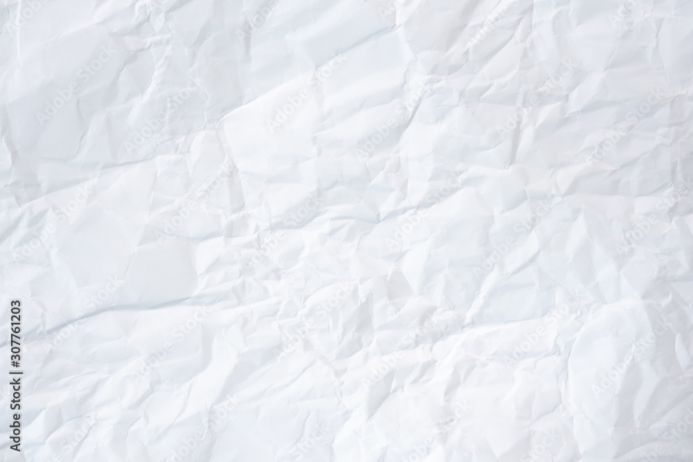 white and gray crumpled paper texture background. crush paper so that it becomes creased and wrinkled. white and gray crumpled paper texture background. crush paper so that it becomes creased and wrinkled.