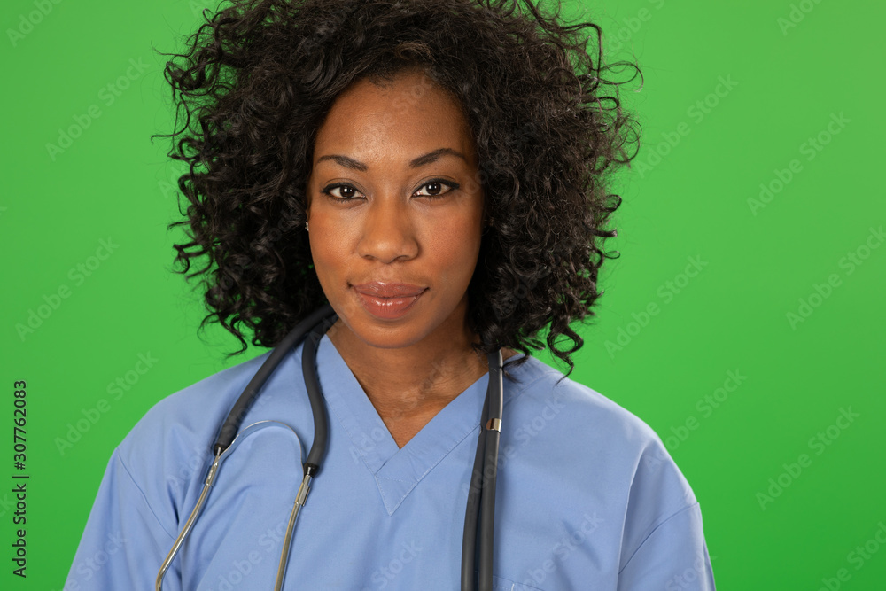 Portrait of happy smiling black female nurse on greenscreen Portrait of happy smiling black female nurse on greenscreen
