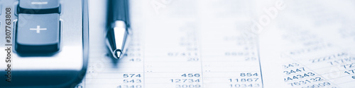 Fotografie Close-up Pen And Calculator On Financial Report - Business Accounting Concept