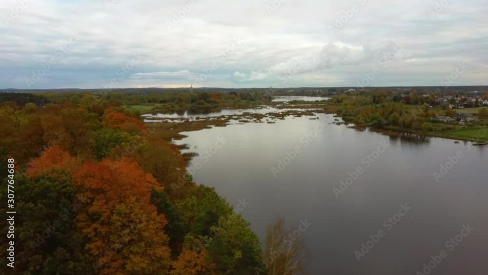 Fly Above Doles Sala, the Second Largest Island in Latvia. This is a Peninsula in the Daugava River, Near the Borders of Riga. Aerial Dron Shoot. Sunny Autumn Day. Fly Above Doles Sala, the Second Largest Island in Latvia. This is a Peninsula in the Daugava River, Near the Borders of Riga. Aerial Dron Shoot. Sunny Autumn Day.