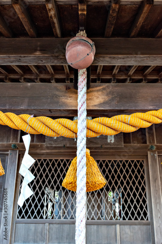 Sacred ropes and bell of Aoyama shrine located in Sasayama castle, Hyogo prefecture, Japan photo