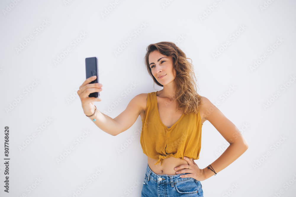 Skeptical woman taking selfie
