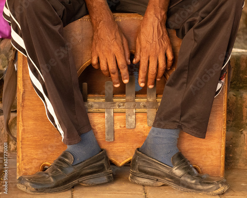 a Musical instrument, Mbira, being played in Cuba