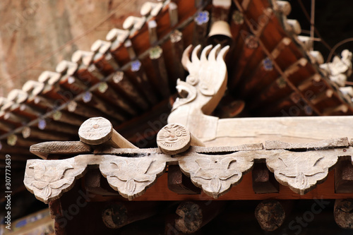 Architectural details of the roof at Tianshui Wushan Water Curtain Caves, Gansu China. OR Temple roof details at the Water Curtain Caves in Wushan , Gansu, China.