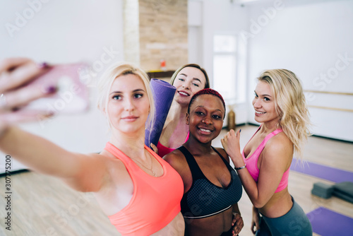 Multiethnic sporty attractive women taking selfie