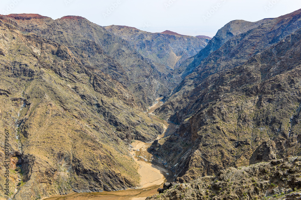 Deep mountain canyon arid river, top view