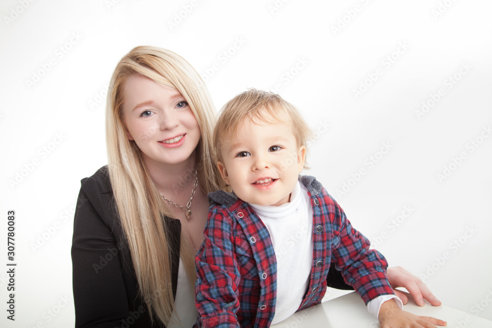 smiling mother and toddler boy on white background smiling mother and toddler boy on white background