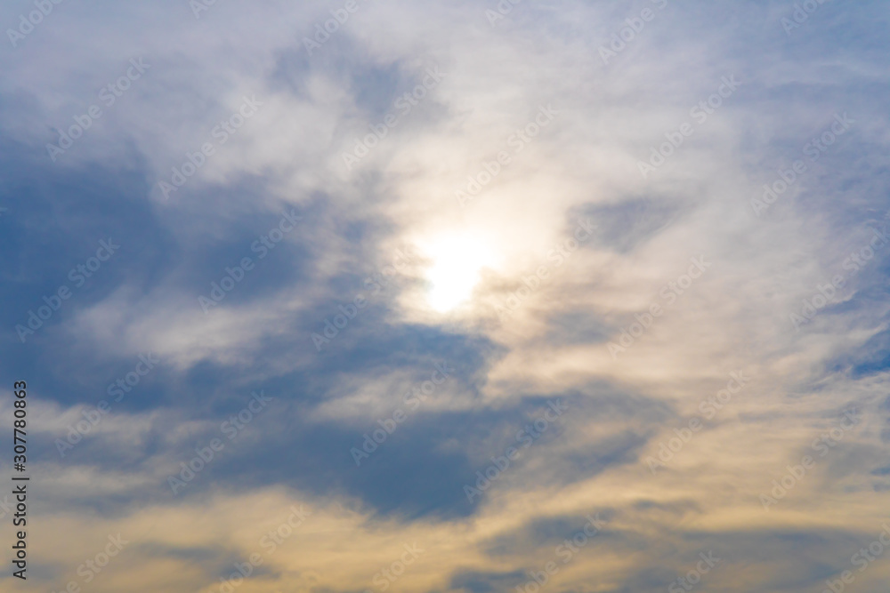 Abstract image of clouds in front of sun at evening or sunset time.