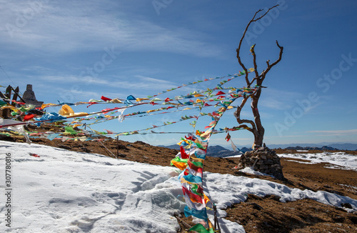 Tibetan prayer flags on mountain top in Yunnan, China