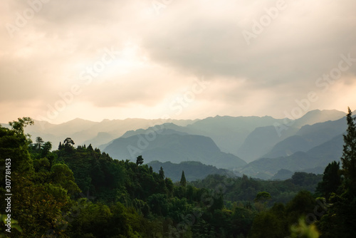 Beautiful mountains and forests with fog.At sunset. © photobee