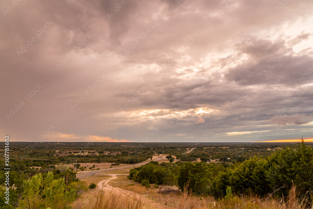 View of Sunset With Storm in the Sky Over the Open Texas Hill Country Lands
