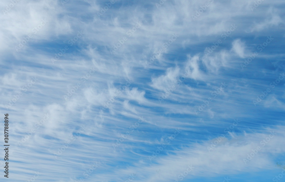 Fototapeta premium Blue sky with white clouds like waves