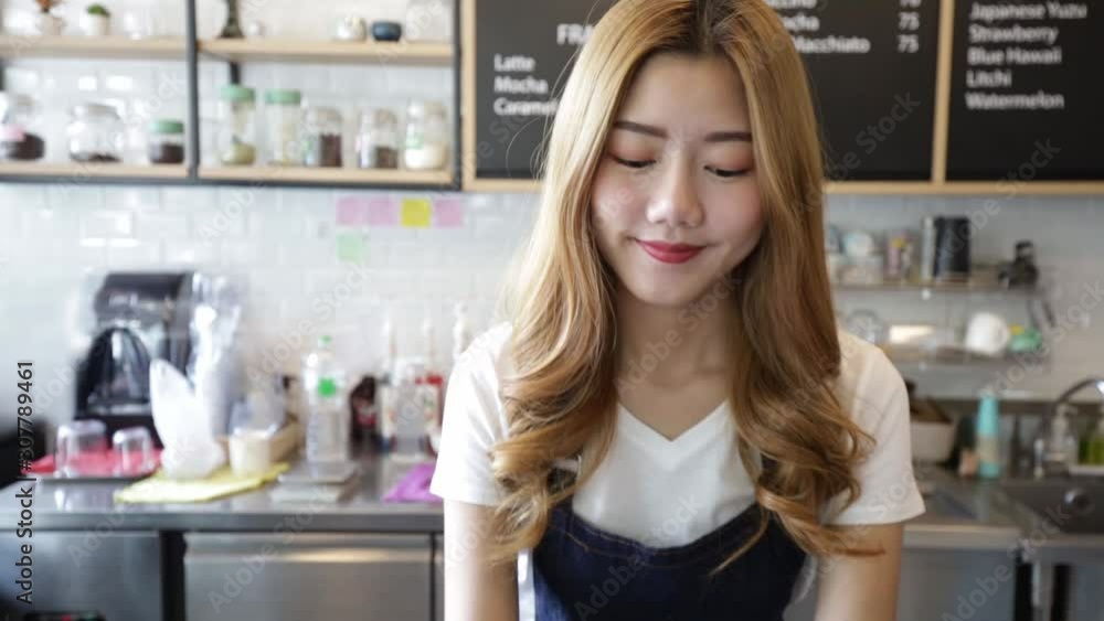 Beautiful Smiling AsianWoman Passing Coffee Cups To Go Toward Client Happy Barista. Owner Young Entrepreneur Passion .Small business owner Korean girl in apron relax toothy smile looking. Beautiful Smiling AsianWoman Passing Coffee Cups To Go Toward Client Happy Barista. Owner Young Entrepreneur Passion .Small business owner Korean girl in apron relax toothy smile looking.
