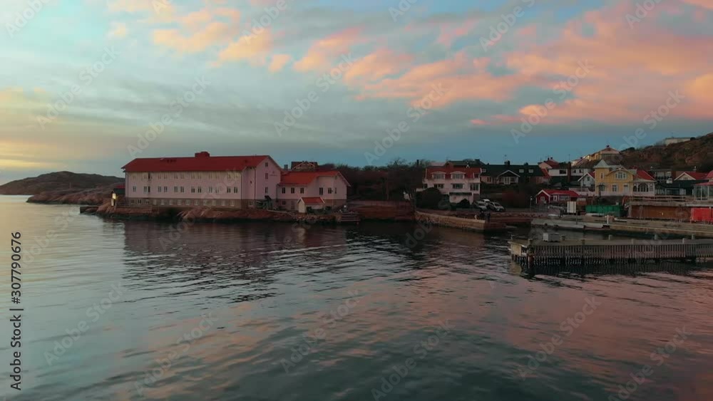 Beautiful Houses In The Port Of South Harbour, Lysekil, Sweden Under The Colorful Sky During Sunset - Wide Shot Beautiful Houses In The Port Of South Harbour, Lysekil, Sweden Under The Colorful Sky During Sunset - Wide Shot