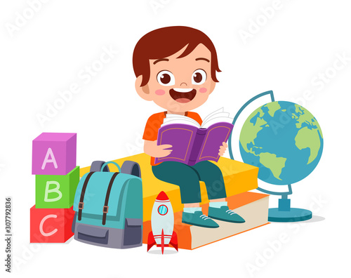 happy cute smart kid boy read book