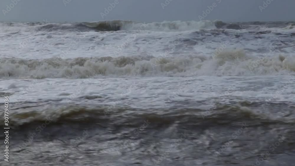 River Axe estuary in Devon, UK. Waves of water of the river and the sea meet each other during high tide River Axe estuary in Devon, UK. Waves of water of the river and the sea meet each other during high tide