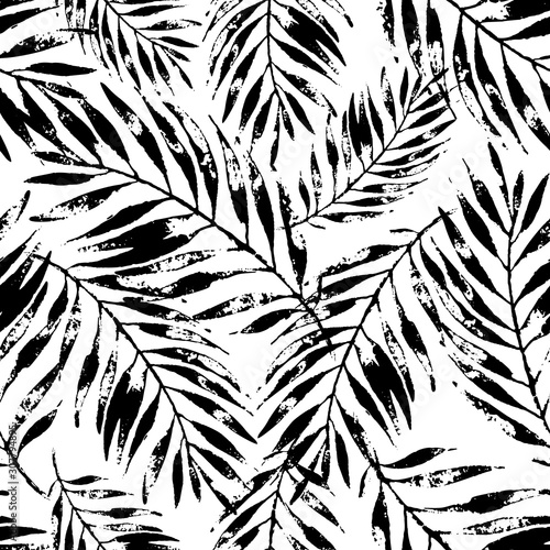 Summer art illustration: rough grunge tropical leaves background in black and white colors.