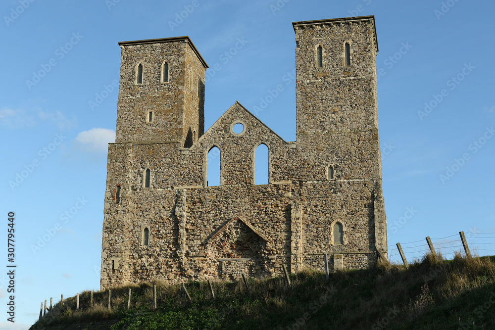 Reculver towers a roman saxon shore fort and remains of a 12th century church undercut by coastal erosion.