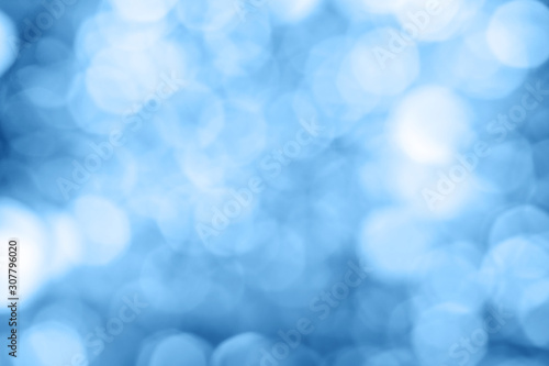 Color of 2020. Unfocused classic blue bokeh light background.