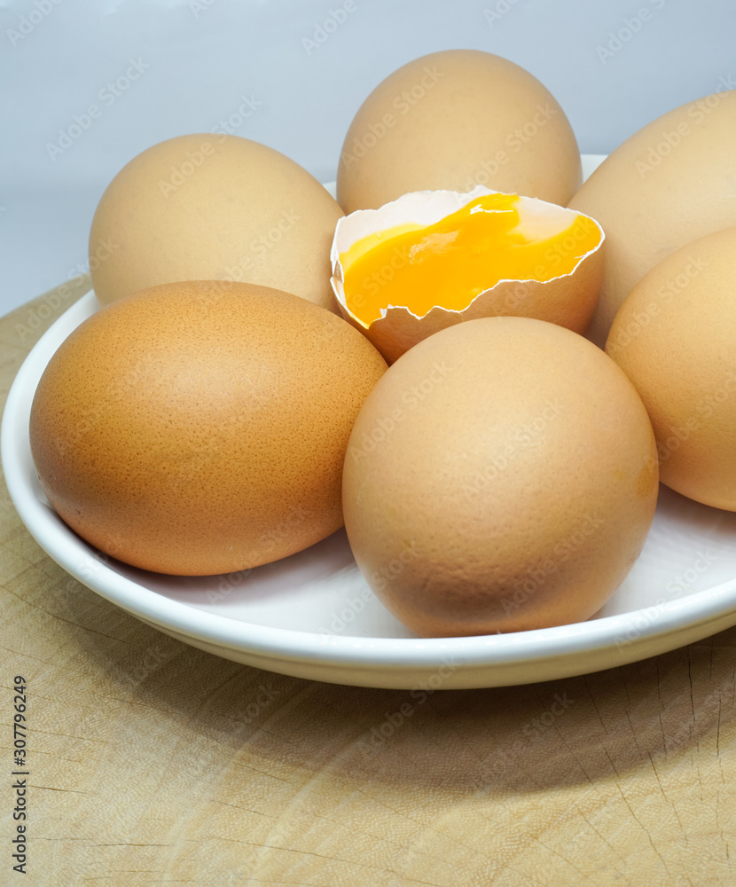 organic eggs in white dish isolated on white background organic eggs in white dish isolated on white background