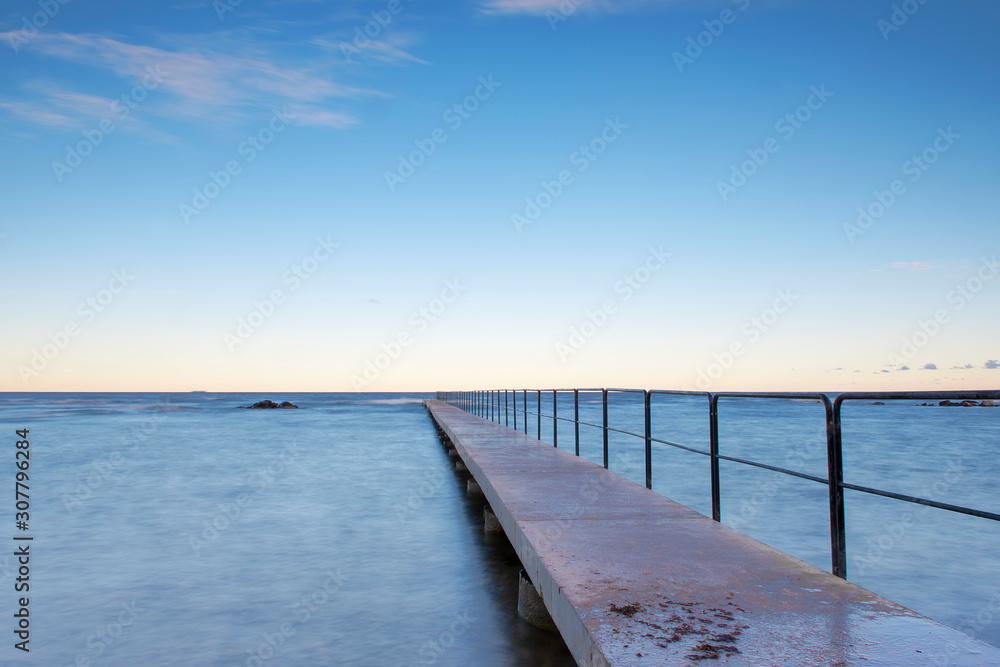 Fototapeta premium Bath pier during sunrise at island of Gotland, Sweden