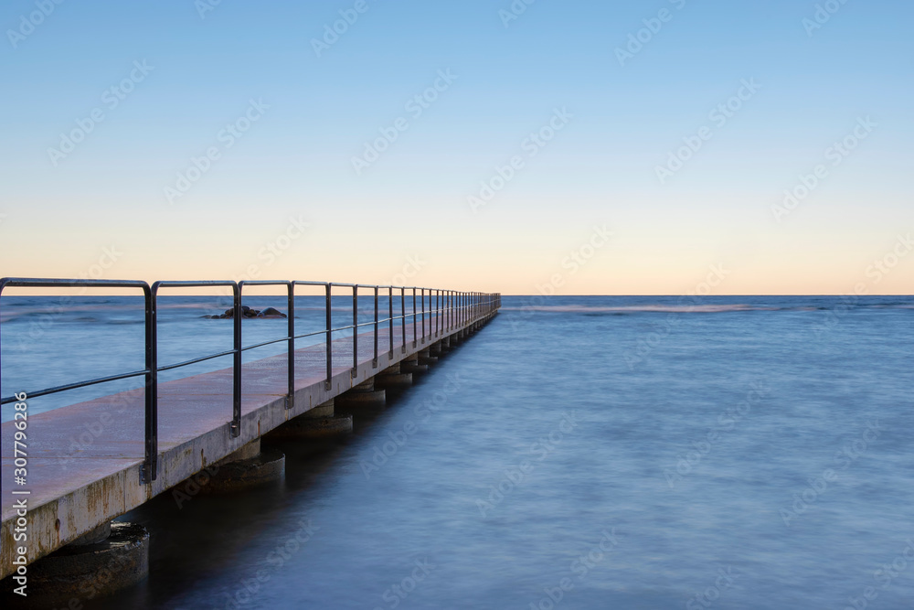 Bath pier during sunrise at island of Gotland, Sweden